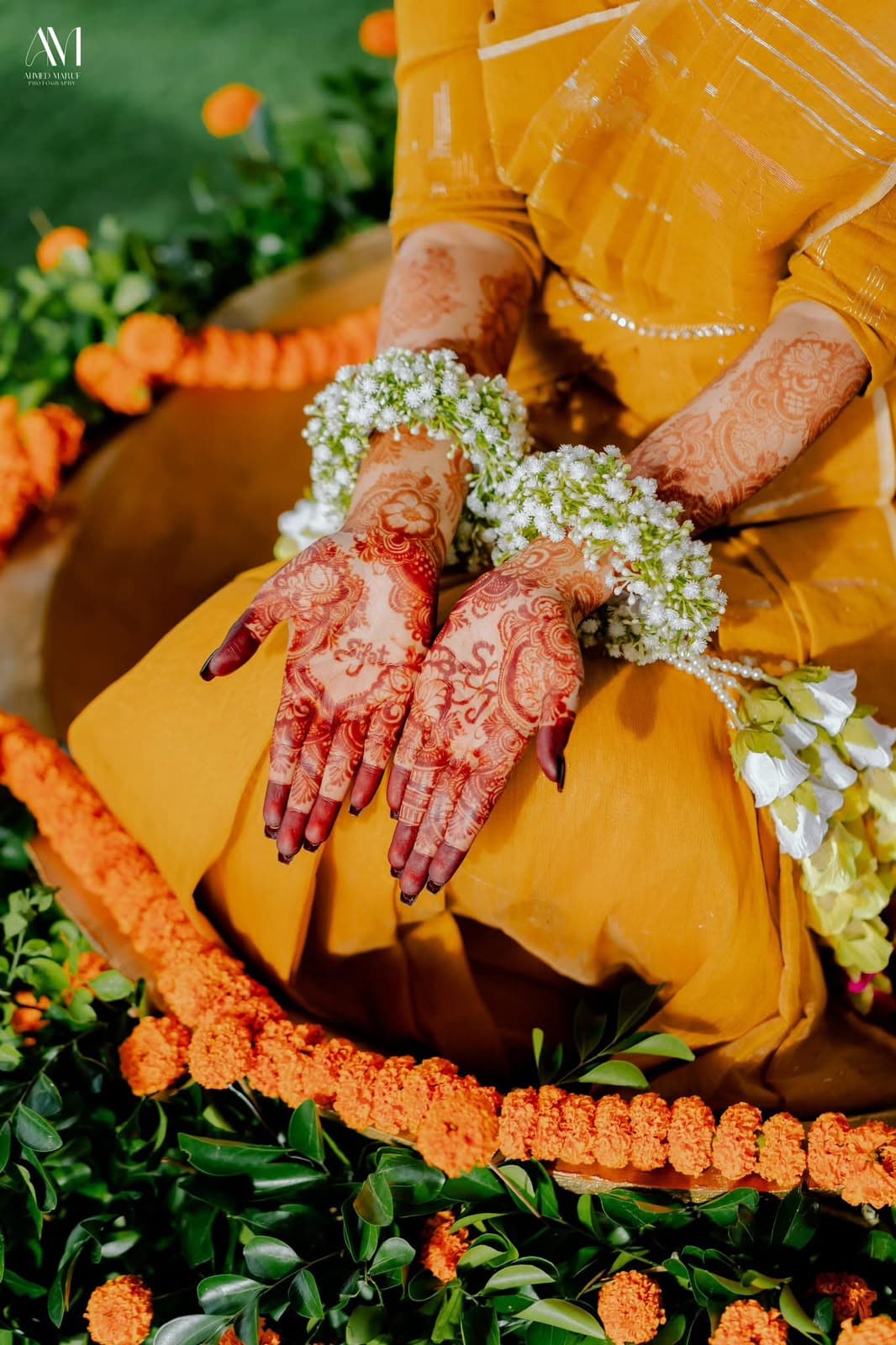 Marigolds, turmeric, and henna-stained hands.